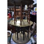 A group of early 20th Century Chinese Asiatic folding opium tables with decorated charger tops