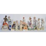 A collection of porcelain figurines to include Staffordshire flat backs , continental examples ,