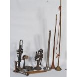 A collection of 20th Century musical instruments to include long horns ,