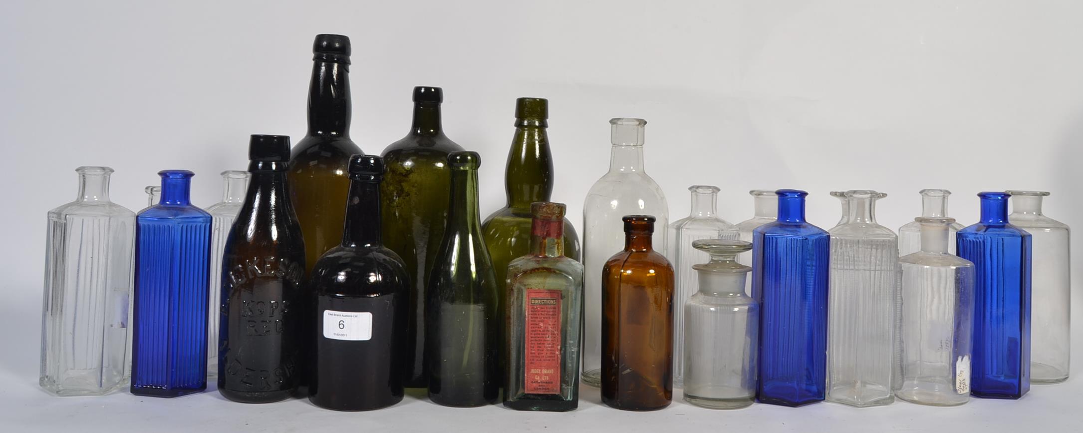 An assortment of vintage glass bottles to include Bristol blue examples,