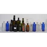An assortment of vintage glass bottles to include Bristol blue examples,