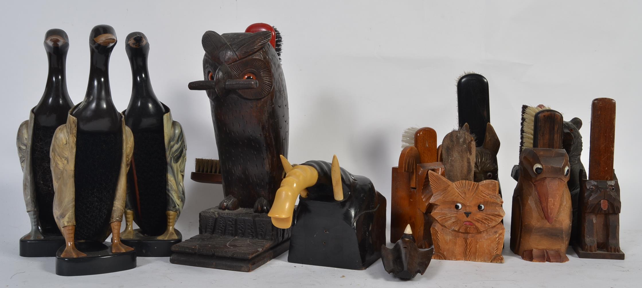 A collection of vintage animal clothes brushes holders to include three bakelite 1950s duck