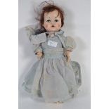 A vintage 1950s Pedigree toy doll in original vintage dress