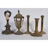 A Victorian cast iron doorstop along with a pair of art deco candlesticks on three tier bases ,