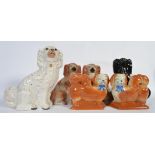A group of 6 Staffordshire fireside dogs to include a Victorian pair and others