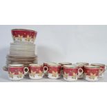 An early 20th Century 10 person part tea service in red autumn pattern (3518) consisting of 10