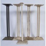 An unusual set of 19th Century cast iron coffin stands on two tier bases with quad Roman pillar