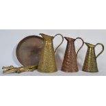 A 19th Century copper jug of snakeskin design stamped JS & S along with two similar brass jugs