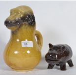 An unusual Victorian novelty jug in the form of a grotesque monkey along with a glazed pottery