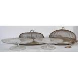 Two Wirex meat / cake cloches with sliver plate trays along with a pair of well decorated glass