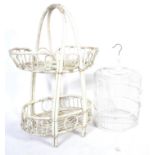 A 20th Century painted conservatory whicker whatnot etagere two tier basket along with a painted