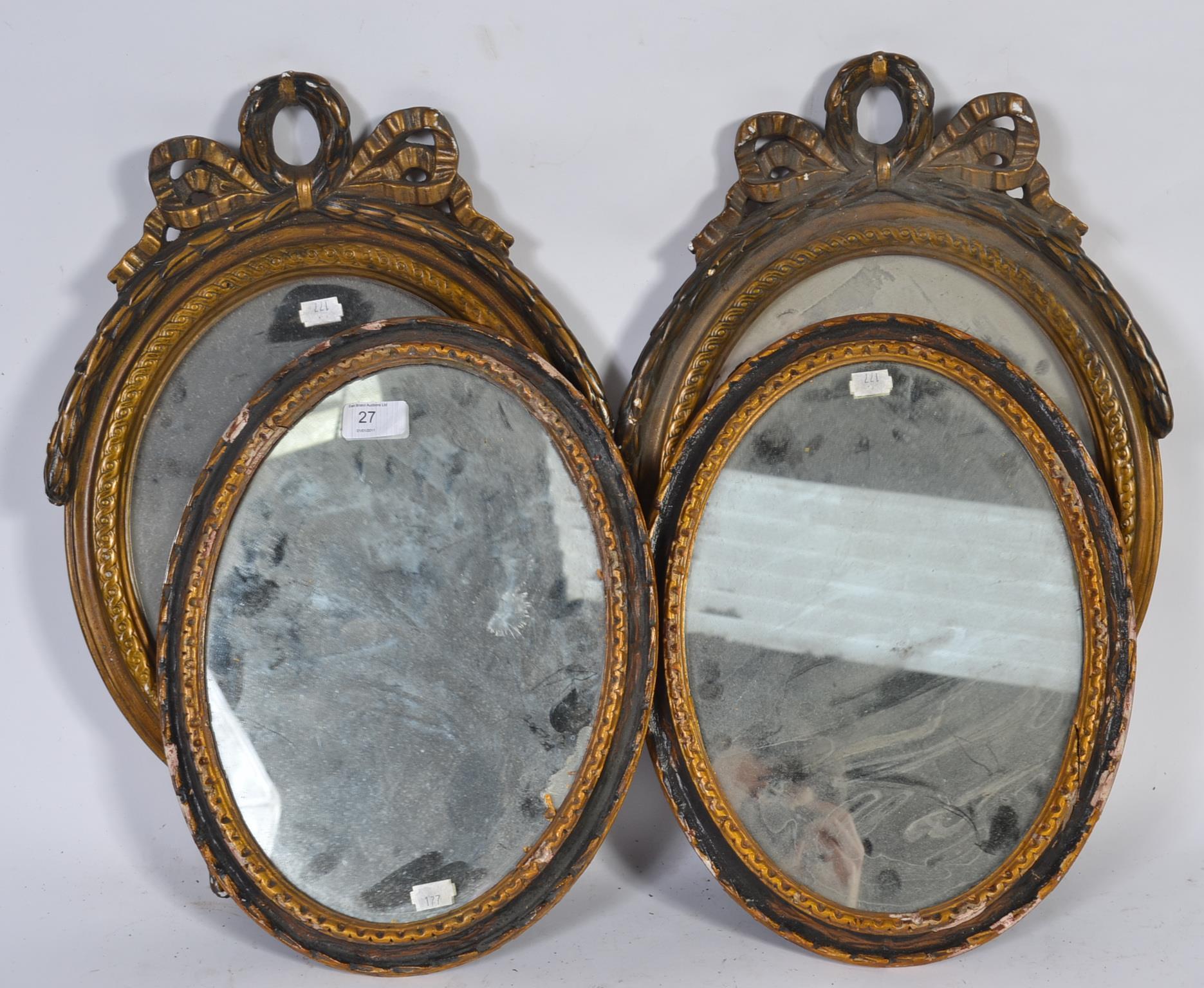 Two pairs of 20th Century carved wood framed mirrors of rococo design