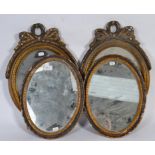 Two pairs of 20th Century carved wood framed mirrors of rococo design