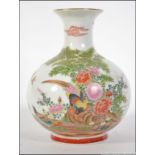 A 20th century Chinese bulbous vase decorated with foliate sprays and birds of paradise with Chinse