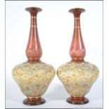 A stunning Pair of Doulton Lambeth Art Nouveau stoneware glazed ochre red vases with waisted tall