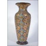 A Royal Doulton Lambeth Slater stoneware vase with gilded and glazed finish with decorative