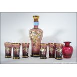 A Bohemian hand painted set with decanter and 6 glasses of small proportion ,