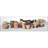 A collection of toby jugs to include Sairey Gamp D5528 and Falstaff D6385 by Royal Doulton,