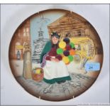 A Royal Doulton wall plate depicting ' The Balloon ' seller, stamped to the back.