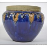 A Doulton Lambeth blue glazed Art Nouveau planter with stylised rim having impressed stamps to the