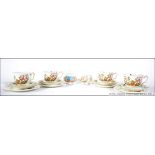 A vintage Aynsley china part tea service in a chintz pattern to include cups, saucers,