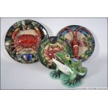 A collection of three Majolica sea themed wall plates depicting a Lobster and Crabs along with a