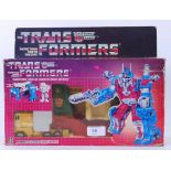 TRANSFORMERS: A vintage G1 Transformer ' Ultra Magnus ' action figure, within the original box.
