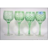 A set of 4 Bohemian green flashed wine g