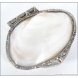 A silver white metal and mother of pearl