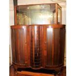 A 1950's walnut display cabinet with rev