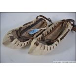 A pair of old rawhide ethnic inuit mocca