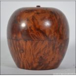 A Georgian style olive wood tea caddy in