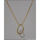 A 9ct gold and diamond necklace. This in