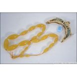 A celluloid handbag top / clasp carved i