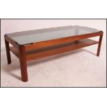 A vintage mid century teak coffee table