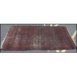 A large Persian type floor rug decorated