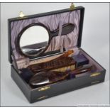 A vintage cased vanity set, appearing to