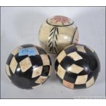 A collection of 3 bone - horn balls of s