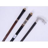 SWORD STICKS: A Collection of three 20th century sword walking sticks.