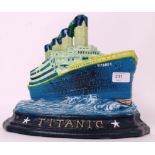 TITANIC: A 20th century cast iron doorstop in the form of White Star Line's Titanic. Hand painted.
