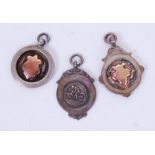 FOB MEDALS: A collection of three vintage hallmarked silver fob medals,