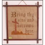 A framed and glazed religious needlepoint study with notation ' Bring thy sins and sorrows here '