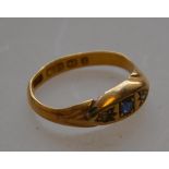 A hallmarked 22ct gold antique sapphire and diamond ring in near gypsy mount.