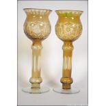 A pair of 20th century cut glass Bohemian tall bowl vases in yellow with etched decoration.