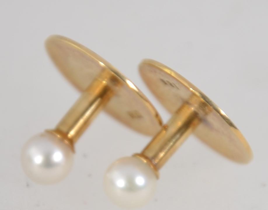 A pair of 18ct gold and pearl shirt dress studs in original fitted presentation box from the