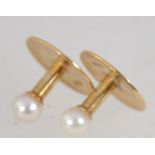 A pair of 18ct gold and pearl shirt dress studs in original fitted presentation box from the