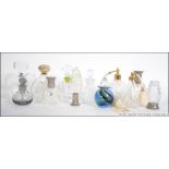 A collection of vintage and later glass perfume bottles to include cut glass, Royal Doulton,