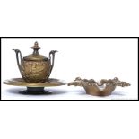 A Victorian brass inkwell in the form of a twin handled amphora having hinged lid together with a