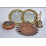A brass framed convex mirror together with another brass porthole mirror,
