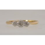 An 18ct gold and platinum diamond ring set with a central diamond with illusion platinum stones